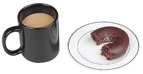 Break time! - A cup of coffee in a black mug. It is milky coffee not black coffee. Next to it is a white plate. On the plate is a piece of chocolate cake. A bite has been taken out of the confection.