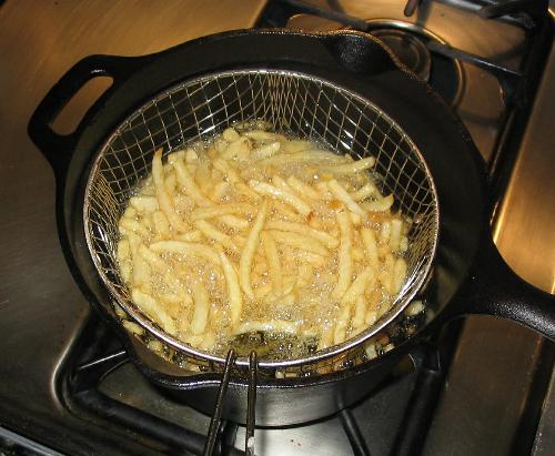 Fries - This is a picture of fries being cooked in oil.