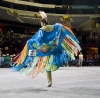 Pow Wow - A native american dancer wearing a beautiful shaw.