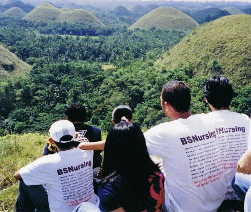 Bohol, Philippines - This photo was taken during our vacation at Bohol, Philippines. The cute humps of land that you see on the picture is called the 'CHOCOLATE HILLS'. It's really a good feeling looking at those marvelous creations of God. You should go there also and check out the place.