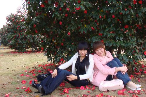 my friend and i - haha..the flower is called chahua in china
