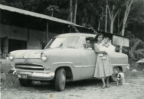 Mom, Dad and Me - Taken in 1959 or 1960, I believe. We were one of the few families who actually owned a car in the jungle of New Guinea.