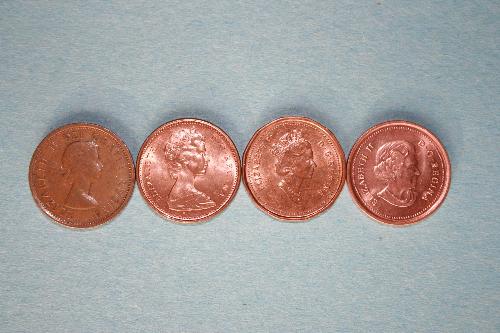 Elizabeth II Canada Pennies - Four Canadian pennies featuring Queen Elizabeth II at various stages in her reign from youth to the present, as featured on the nation's coin.