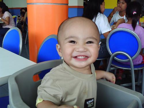 my son Jamiel Myles - We're eating jollibee in this picture and he just smiles when he files like it. Good thing I had my phone cam ready. ^_^