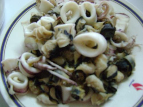 boiled squid - Seafood is a favorite to the Thai people and of course, squid is one of them. The picture on the dish is only boiled,the taste comes from the dip that comes with it. The taste is said to be good when it tastes sweet, that means that the squid is still fresh.(I don't eat seafood, by the way!)