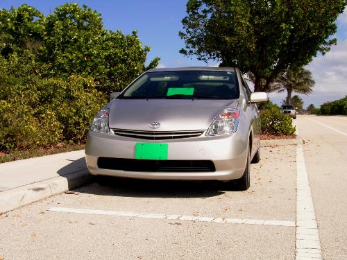 A Toyota Prius Hybrid photo with Eco Green License - A silver Toyota Hybrid Prius with the Environmental Green License Plate campaign by EarthRehab. EarthRehab retails Green License Plates made from 100% recycled plastic milk jugs with proceeds to benefit Environmentally Active non-profit Foundations and Sanctuaries. See who is involved at EarthRehab.com  It's like a live strong bracelet for the Environment, with greater visibility.