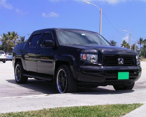 Black Honda Ridgeline with Green License Plate - A Black Honda Ridgeline with the Environmental Green License Plate by EarthRehab.  EarthRehab retails the Green License Plate online for $10. with proceeds to benefit Environmental Foundations and Sanctuaries. Its like an Eco live-strong bracelet with a much larger viewing crowd. Currently over 40,000 commuters per day view the Green License Plate and understand that we support Nature Research. Visit EarthRehab.com or mygreenlicenseplate.com today