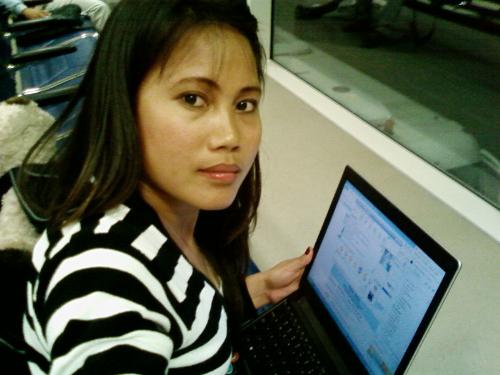 Chatting in the Airport - this photo is taken in Qatar Airport, while waiting for my flight to Cebu just have a quick chat to my husband.