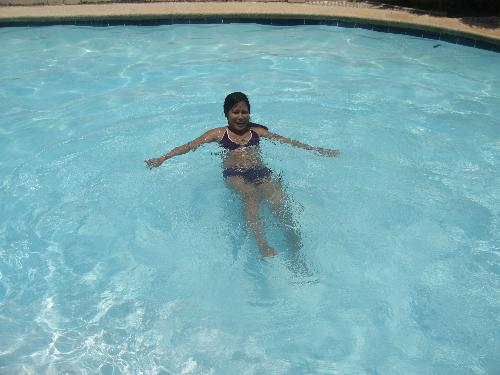 swimming in the pool - this is my way of losing weight swimming everyday in the pool but I'm just woried becuase the more I went into swimming the more I get my skin darker