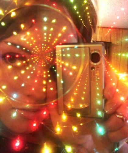 light mirrors - This is actually one of four mirrors in a wall decoration we have. It has a ring of colored lights around the inside edge, with lots of mirrors. Way cool.