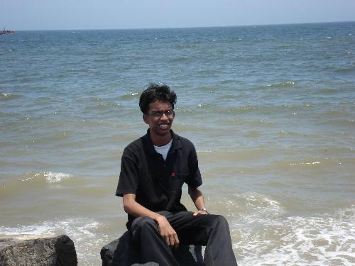 Alone @ d rocks!! - dis foto was taken @ pondy beach!! i was so desparate to sit on d rocks and take a snap... but believe me i got scared wen i started posing for d foto..