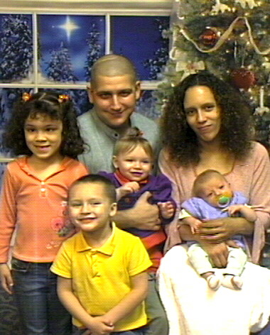 christmas 07 - me, hubby, shylynn, johnny, skylar and justin.  one big happy family.  photo was taken in nov of 07 for xmas of 07. at the time i was 25, huby 25, shylynn 5, johnny 4, skylar a year old, justin 2 months.