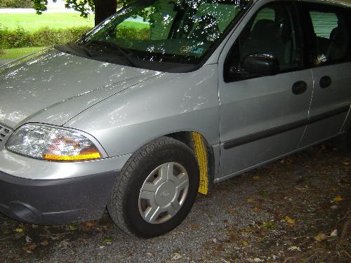 Road Paint behind my Tires - October 2007 - Yellow street paint got spashed up under my tires.