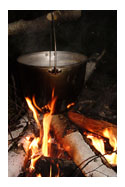 Kettle Over Fire. - The kettle can cause damage if it is held close to you. Keep this in mind and you will never get burnt.
