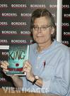 Stephen King picture - Stephen King picture holding a book