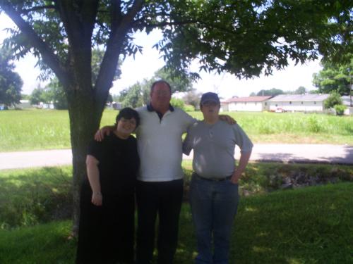 My daughter and son taken with their daddy yesterd - I took this picture of my son and daughter with their daddy yesterday on father's day. When you see the picture of me in my avatar you can see if you think either of them look like me LOL!!
