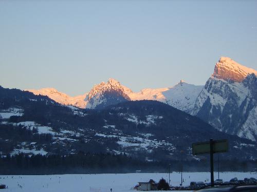 Mountain Sunset - Mountain Sunset taken in the Grande Massif area of the French Alps. Sunset bounces off the snowy mountain tops creating a wonderful effect.