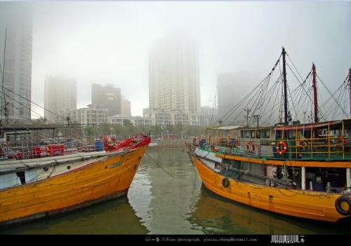 Harbor in the rain - This photo was taken at JiuZhou harbor in ZhuHai, China.  It has been raining for twenty days, heavy rain continuous after a few brief interval. The thick mist clouded the beautiful harbor.