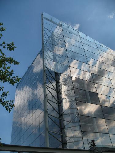 Reflecting the Sky - A glass pyramid forming part of the National Aquarium in Baltimore is almost invisible behind its perfect reflections of blue sky and white clouds.