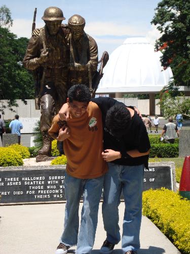 imitation - my two brothers imitating the statue of the wounded soldier