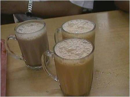 ' Teh Tarik' drink - A Malaysian popular drink of hot frothy tea with fresh milk that been pulled from a metal mug to another until it becomes frothy. It is best served hot with snacks.