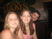 Me, the one with the brown curly hair. - This is me at my 21st bday party! Decided I want a pic of me on here. The other girl is my best friend, and the guy in the back ground is my fiance.