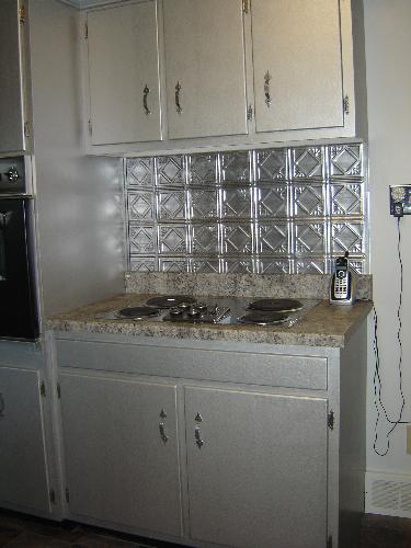 Kitchen Cabinets - My birthmother painted her kitchen cabinets a textured silver.