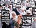 'No person is your friend that demands your Silenc - Picture of Muslims holding signs with Stop the War