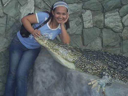 Me and Mr. Crokie - What do you think of this picture? Is it true. hehehehe.. This was taken at Crocodile Park in Davao City Philippines. In tha part you can see all types of crocidile young ones old crokie and even the preserve skeletone of the biggest and oldest crocodile in the philippines. Crocodiles are so wild when they are hungry. Those people who took care of this animals the crocodile I really dont know where they place their fears. I am so fearful for them. When they get inside the cage they only bring with them a long log and they will hit the crocodile with the log if the animal approaches them..Amazingly they are really not afraid to be a food of a crocodile..I guesse they are friends with those animals..hehehehe