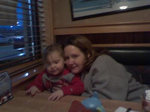 My girls  - My girls at dinner. They are both wearing OSU gear.