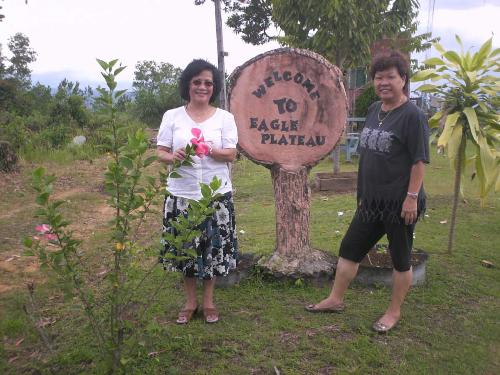 Welcome to Eagle Plateau - A nice pose to welcome you to our family self sufficient retreat where we try to promote a simple lifestyle based on closeness and working with nature and our environment.  Thats my wife Doris and our friend Connie from Australia in the picture taken with the signeage that is actually made from used automoblie tyres wrapped in ferro cement. We try to recycle as many things as we can and enjoy planting fruits, flowers and herbs here at Eagle Plateau. You can get more information from our website at http://www.eagleplateau.co.nr