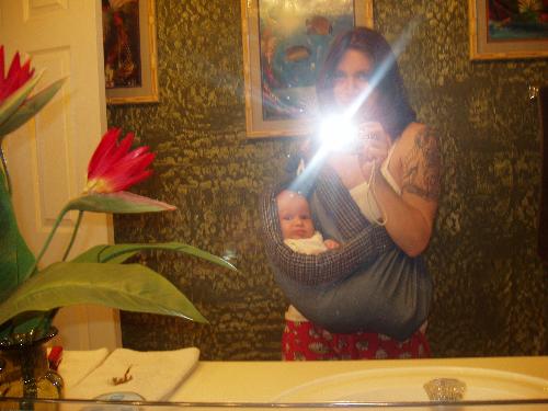 he loves the sling - he loves to lounge around inthesling while i accomplish my chores :)