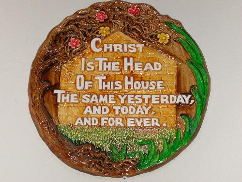 Wall Plaque - Christ is the Head of this House - A wooden plaque mounted onto the wall with the beautiful inscription.