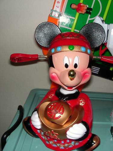 Prosperity Mouse - Bringing New Year Wishes - A mouse dressed up in traditional Chinese costume, bringing Chinese New Year wishes (as depicted by the gold it carried)