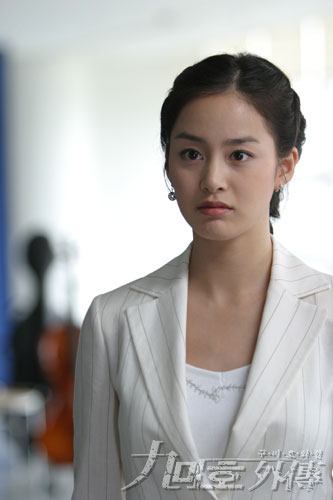 Career Woman - Woman dressed in white suit.