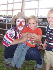Justin with a clown - My oldest son at the Union County Fair Rodeo. Boy, does he love clowns.