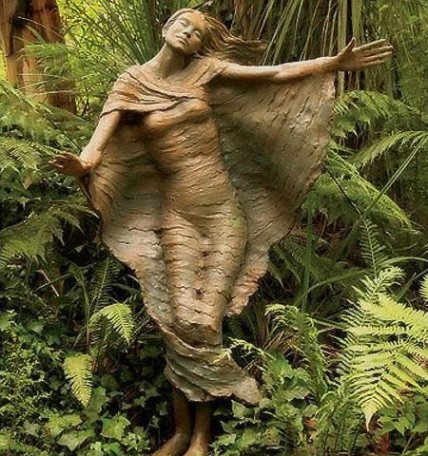 wooden angel - I think this is a stunning example of the love of carving.  How long would this have taken ?
