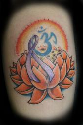 My newest tattoo - This is my newest tattoo! I have just finished a long battle with breast cancer, and also lost both of my grandmothers to cancer. I decided on this tattoo because the lotus represents new birth, the ribbon is for all cancers, the ohm is for inner peace, and the sunshine is for today!
