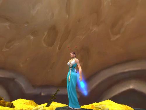 Mage in a Lovely Dress - A 70 mage poses in her prettiest blue dress and blue glowing sword.
