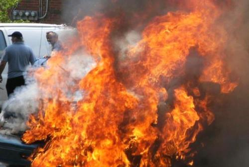 a scary car fire  - car fire out in the road