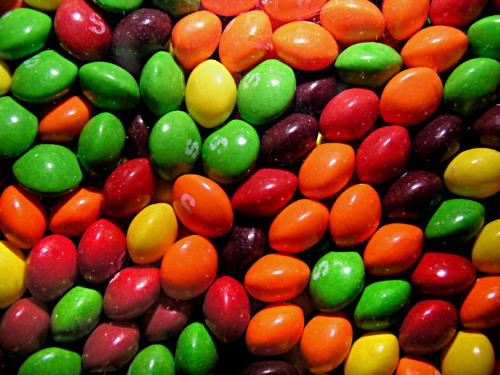 Skittles taste just right! - Except for the fact that they coat your teeth with so much sugar, Skittles are great for a quick treat! You really can't just eat a few--a couple of overheaping handfuls will help to satisfy nearly any craving! I've pictured my favorites, the original, since the combination makes my mouth happy!