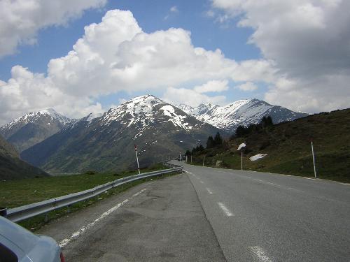 Road - Photo of a road with snow capped mountains in the background.