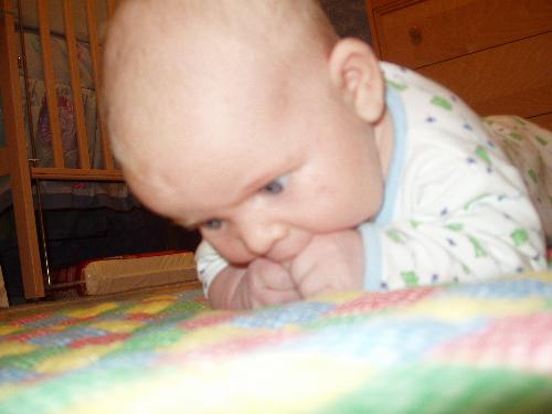 hold that head up - my son can hold his neck up for a while now. its hard to catch him on camera though, hehehe