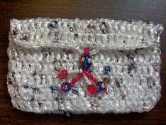 Clutch purse - This little clutch purse/make up bag is crocheted from plastic produce bags