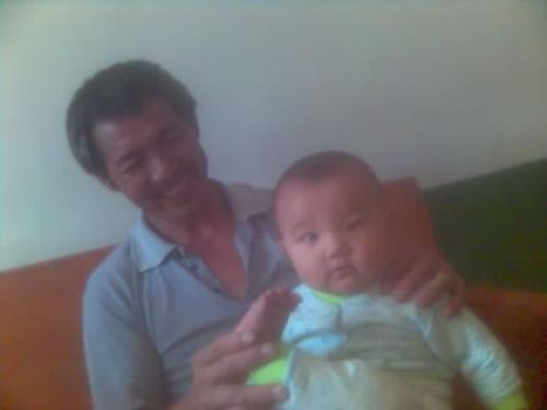 my father - this is the photo showing my father is holding my little nephew.
