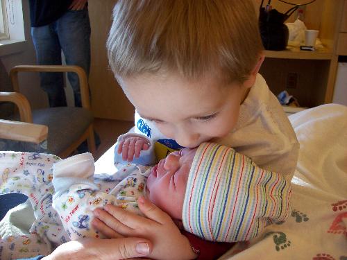 Justin kissing Kylen - This is the day Kylen was born. Justin was so excited about being a new big brother!!!