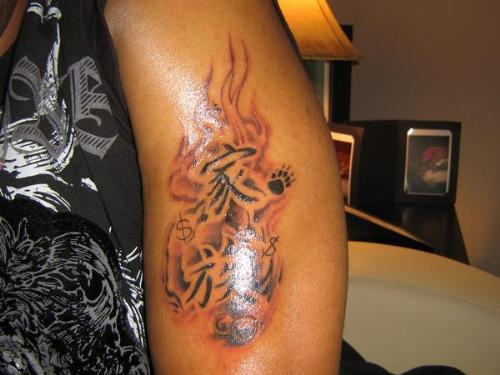 Fam Tat - My bros new tat representing his 2 sisters n mother...bear claw - lil sis....dollar sign - big sis...pearls - mom