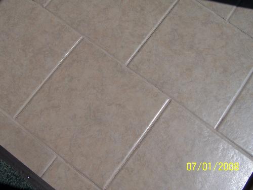 my new tile - here is my new tile in the entrance way and the bathroom.