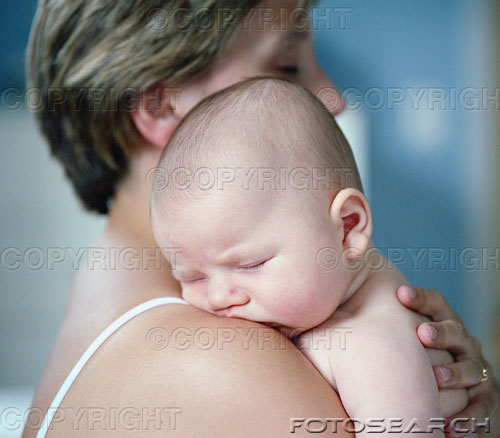 baby - baby boy(0-3months) sleeping on mother's shoulder.