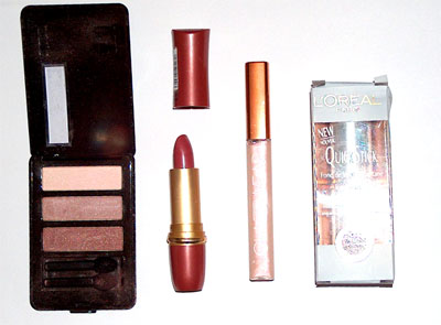 Mixed Make Up Items - A mixed selection of make up items including lip gloss, lipstick, foundation and eyeshadow